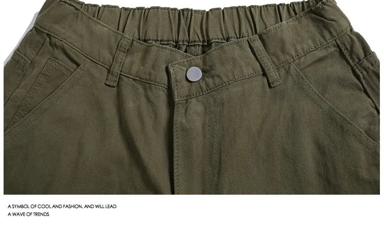 Casual apricot wide-leg cropped shorts with rivet details on a mid elastic waist