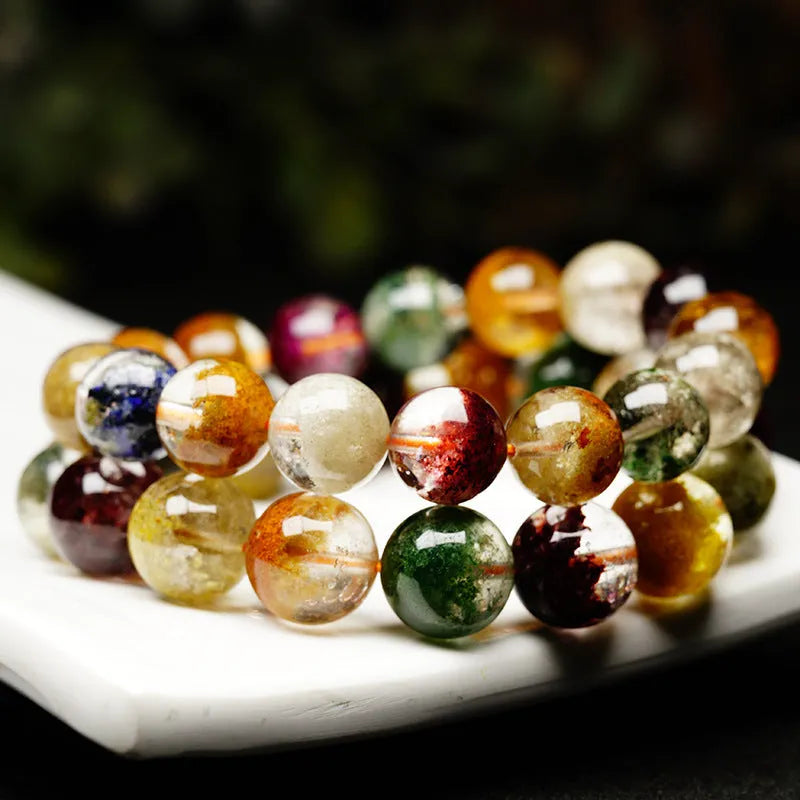 Ethnic style crystal bracelet with 10mm ball beads and colourful ghost cornucopia design.