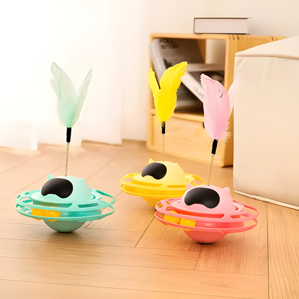 Pink cat tumbler turntable toy with self-hi feature for independent play