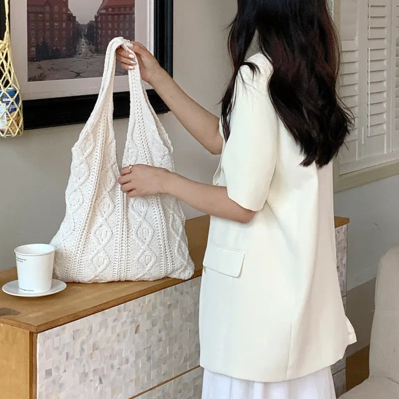 Large retro hollow knitted wool tote bag in a solid colour with double shoulder straps.
