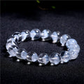 Women's white crystal pyramid bracelet with Ruyi charm in natural ghost colour showing geometric beads