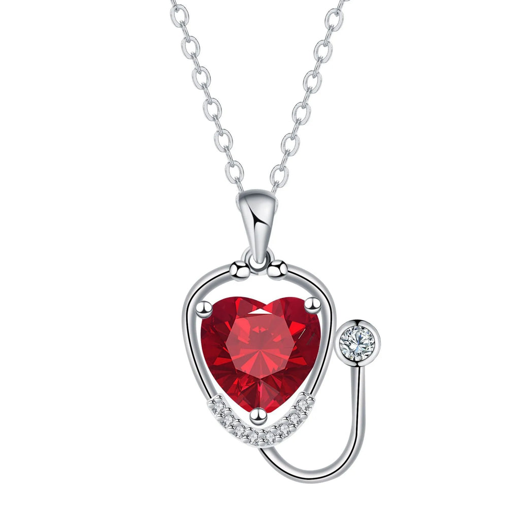 Women's copper necklace with a red diamond electroplated pendant showing stethoscope, wings, and cross design.