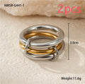 Stacked stainless steel rings with gold plating in coordinated colours showing layered hand jewellery design