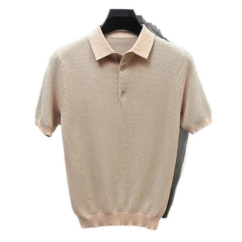 Loose-fitting short sleeve cotton pullover sweater in a neutral colour on a hanger.