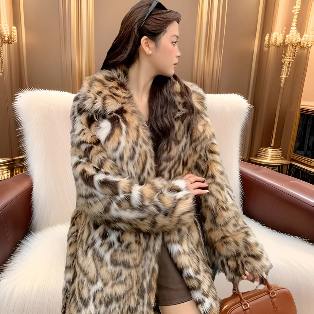 A model wearing a black faux fur mid-length coat with a large fur collar and front pockets.