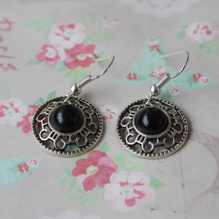 Handmade Miao ethnic silver earrings with turquoise geometric flower disc design