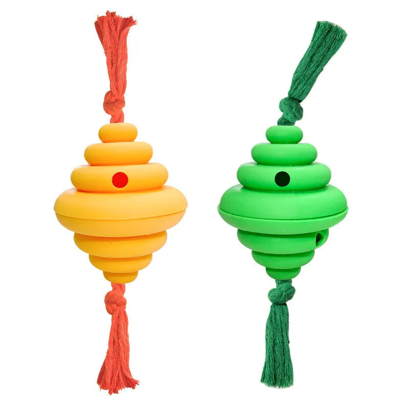 Green and yellow silicone dog ball with integrated rope, shown as a food-dispensing chew and tug toy.