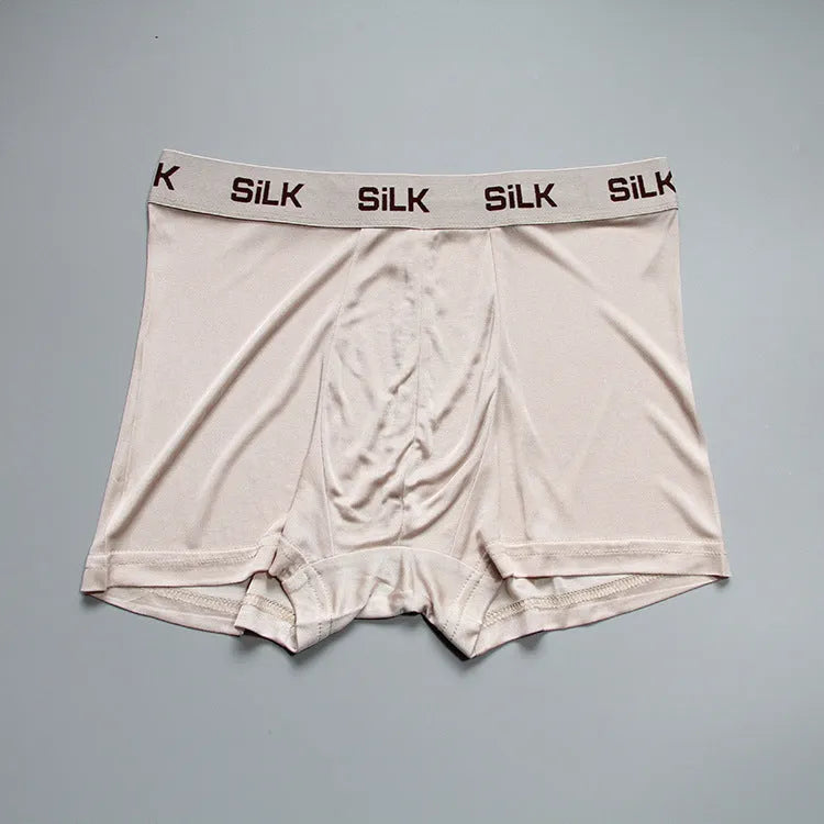 Men's loose-fit silk shorts in navy blue with mid-waist design