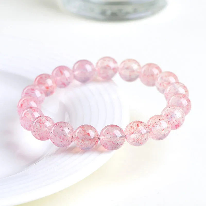 Natural strawberry quartz crystal bracelet with geometric sphere beads measuring 10-10.8mm