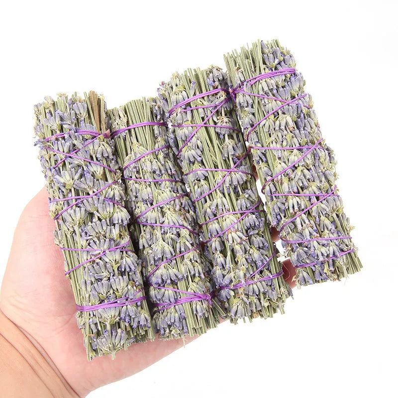 A single 4-inch long dried lavender aromatherapy stick on a plain background.