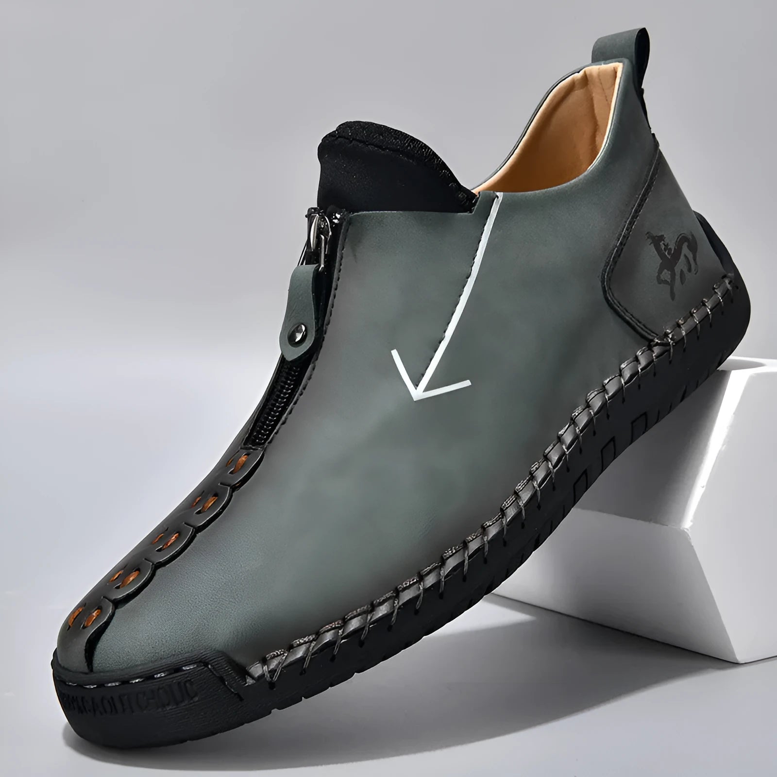 Men's black front-zipper casual leather-style boots with round toe and hand-stitched detail on a white background.