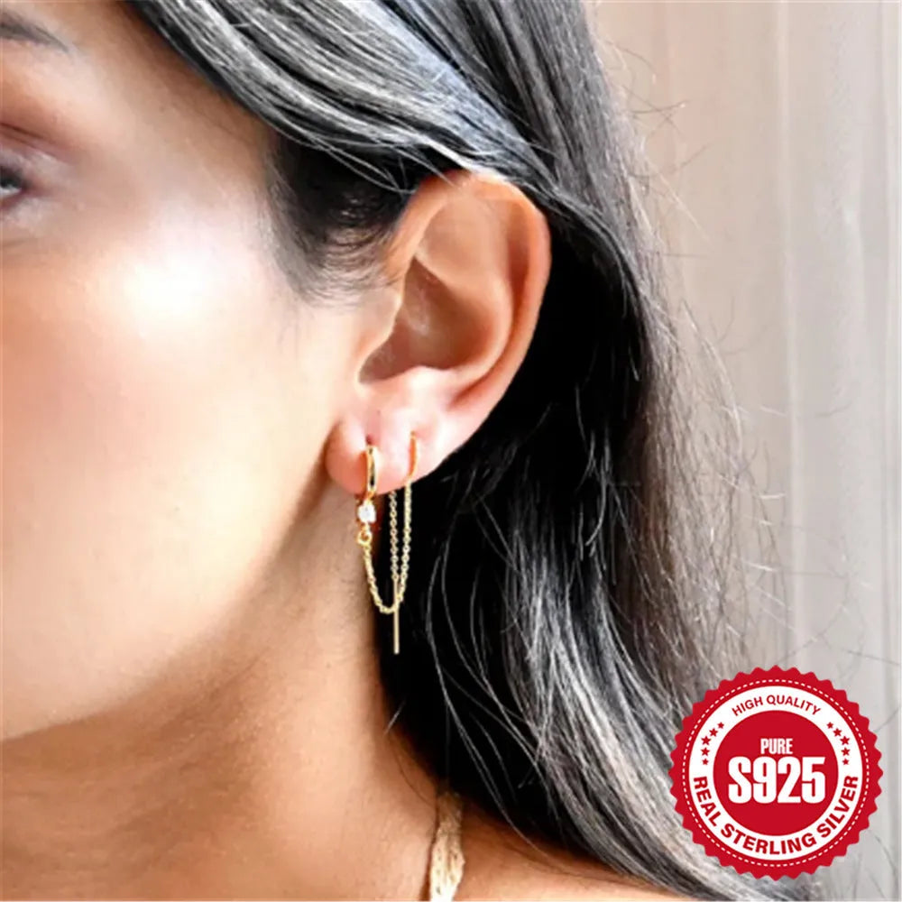 S925 sterling silver geometric ear clip stud earrings with chain, flower and tassel detail in gold electroplated finish.