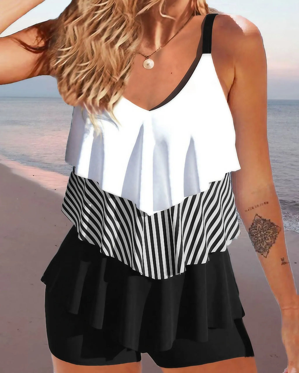 Women's backless bikini swimsuit with spaghetti straps and ruffle detailing in polyester fabric