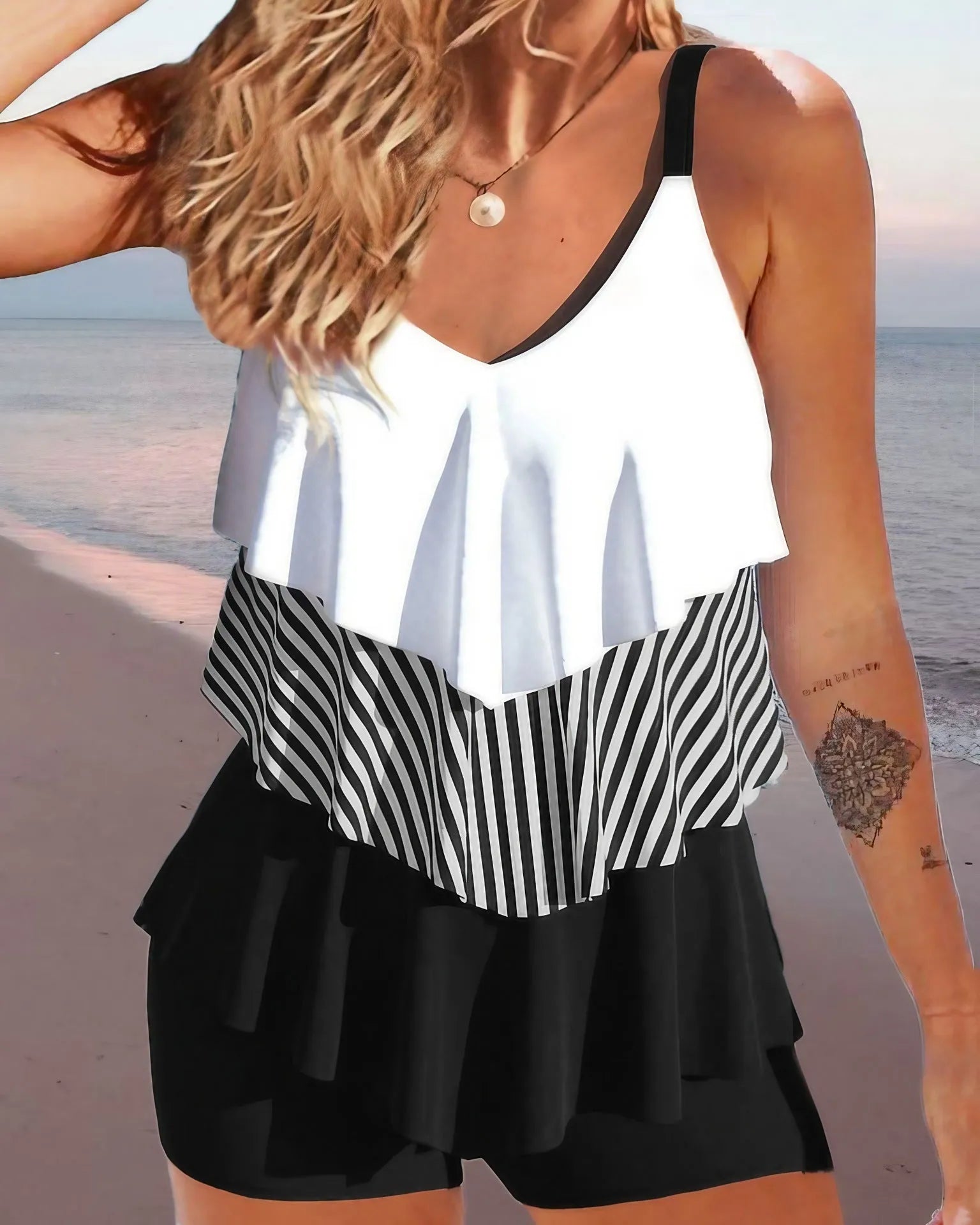 Women's backless bikini swimsuit with spaghetti straps and ruffle detailing in polyester fabric