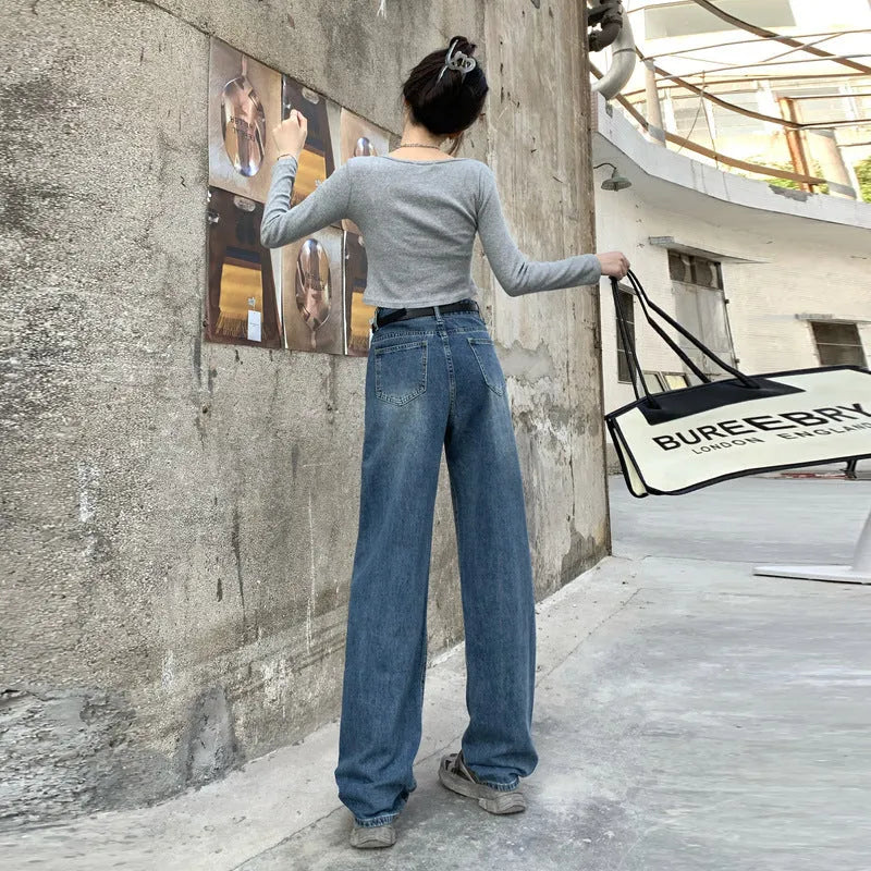 Women's retro blue high-waisted straight leg denim jeans on a neutral background.