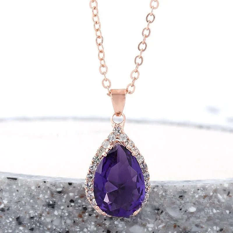 Pink drop shape women's necklace with geometric pendant design and rhinestone details