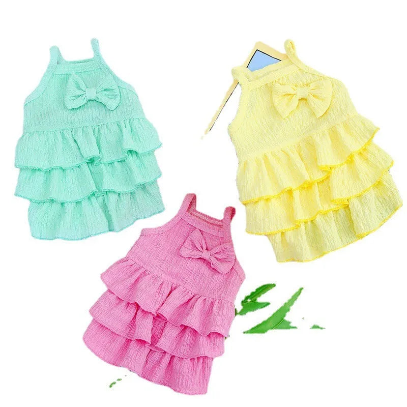 Small dog wearing princess-style dress with candy layered skirt in polyester fabric