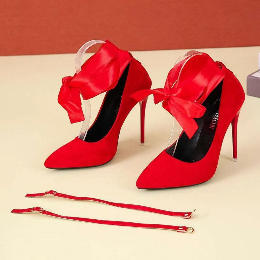 Women's black pointed-toe high-heel shoes with thin strap and flat buckle closure