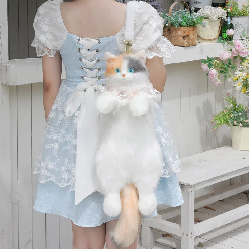 Simulation calico cat backpack plush with lace bell collar, front view, soft plush material