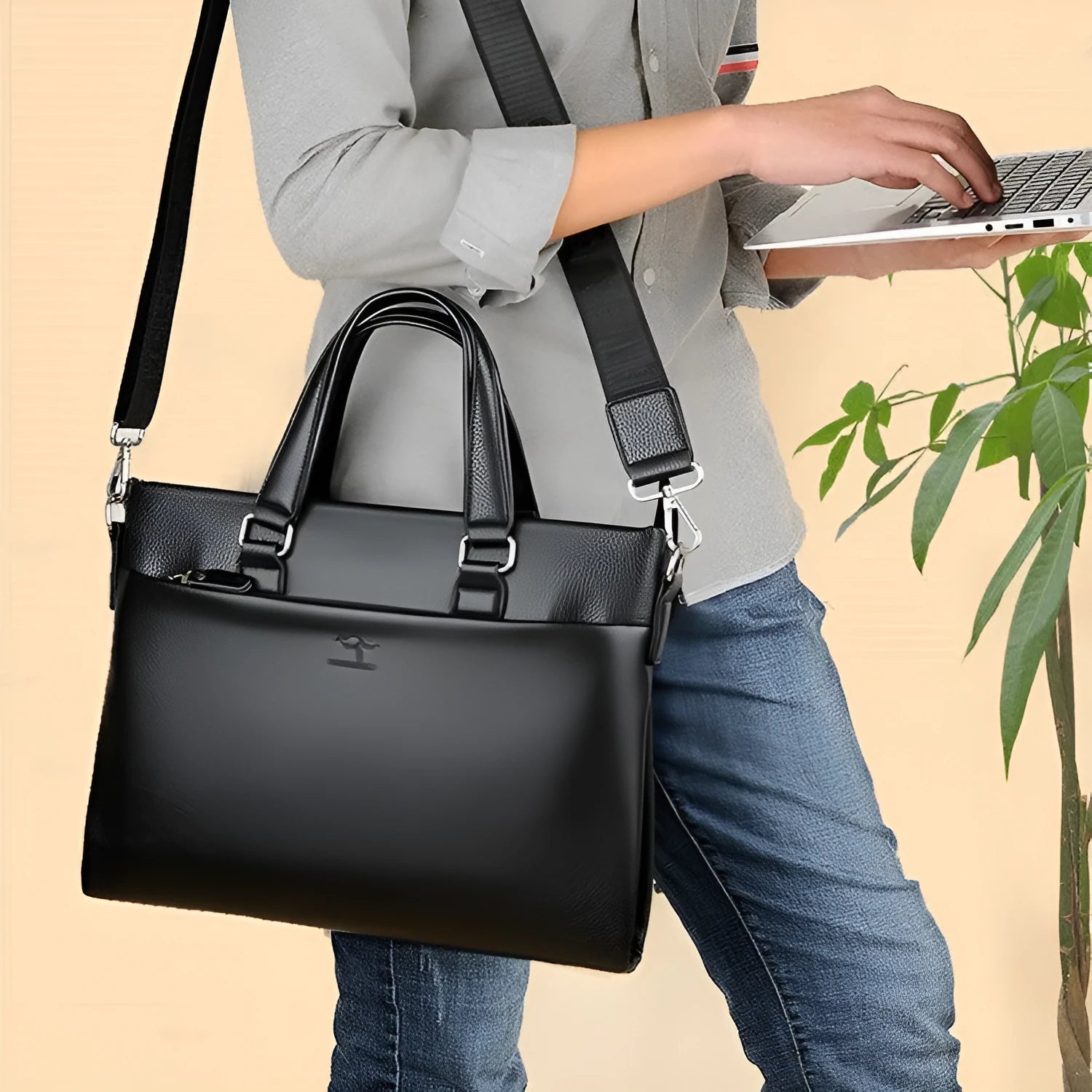 Black PU leather men's messenger bag with crossbody strap and splicing detail.