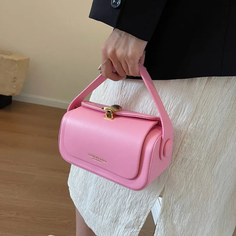 Personalised letter embroidery on a women's beige PU leather shoulder messenger bag with adjustable strap.