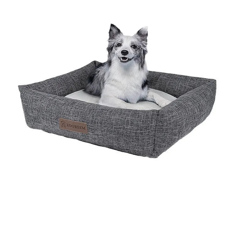 Square grey plaid cloth dog bed for medium-sized dogs on a wooden floor.