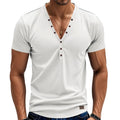 Man wearing a loose fit solid colour V-neck pullover top with a small button design detail.