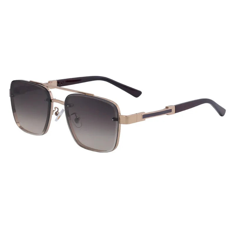 Men's vintage sunglasses with gold frame and grey lenses on a plain background.