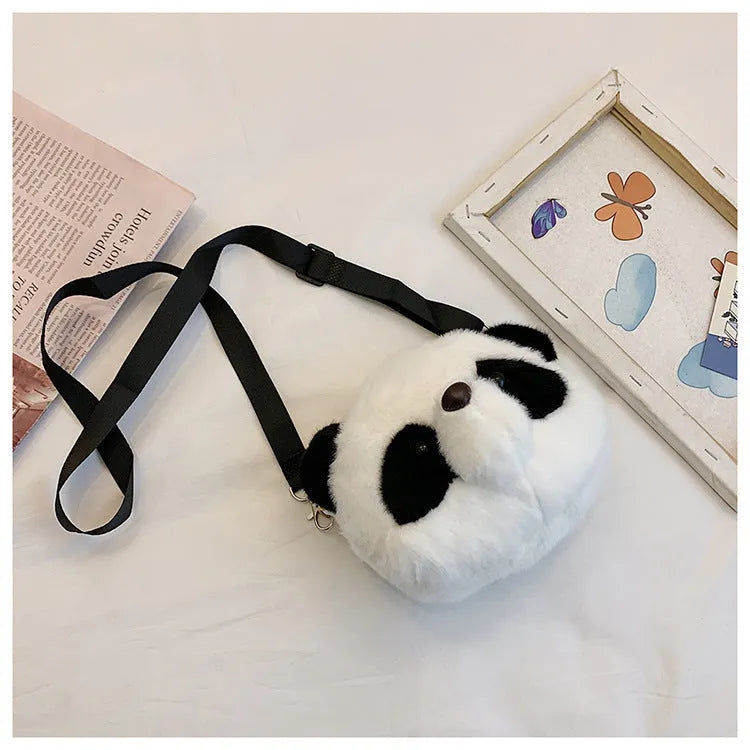 Soft plush panda head design crossbody bag shown in cylindrical shape.