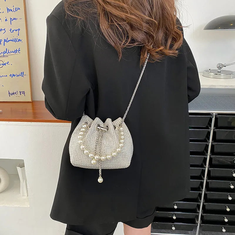 Diamond shoulder strap crossbody bucket bag in soft PU with chain detail and internal organisers