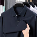 Men's loose fit pure cotton polo shirt with long sleeves and a lapel collar, shown in black.