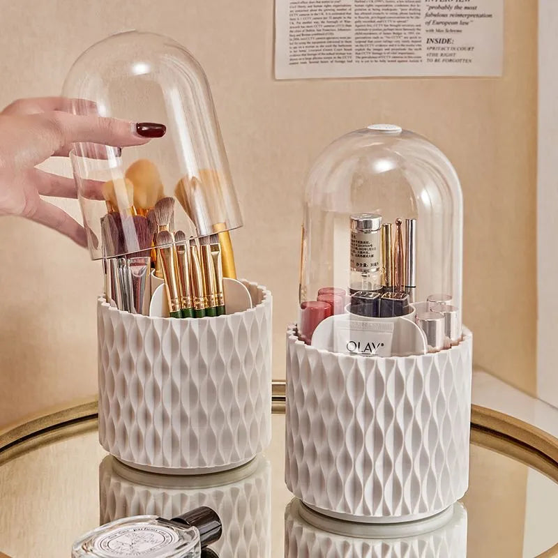 White rotating transparent makeup brush storage box with lid on desktop
