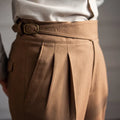 Men's high-waist straight-leg casual trousers in black polyester fabric on a hanger.