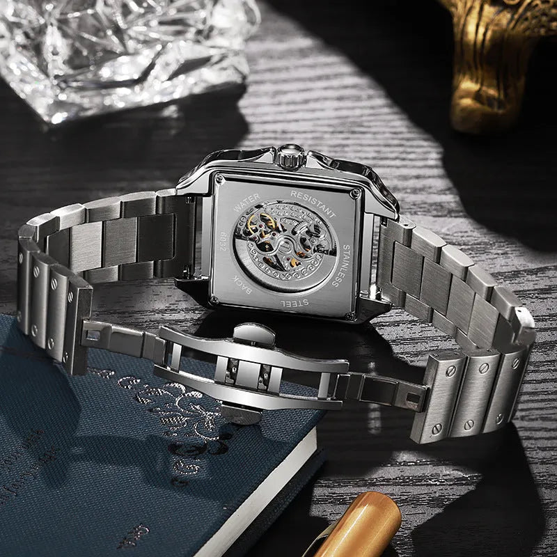 Men's square automatic watch with diamond studs on case, available in black or white with leather or steel strap.