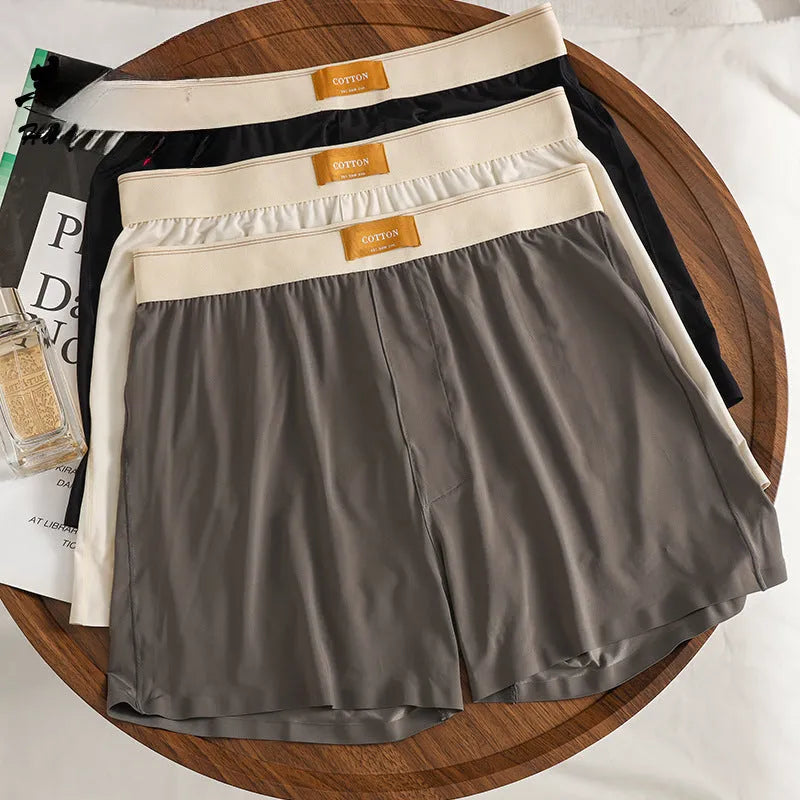 A pack of three pairs of solid colour men's ice silk loose fit boxer shorts.