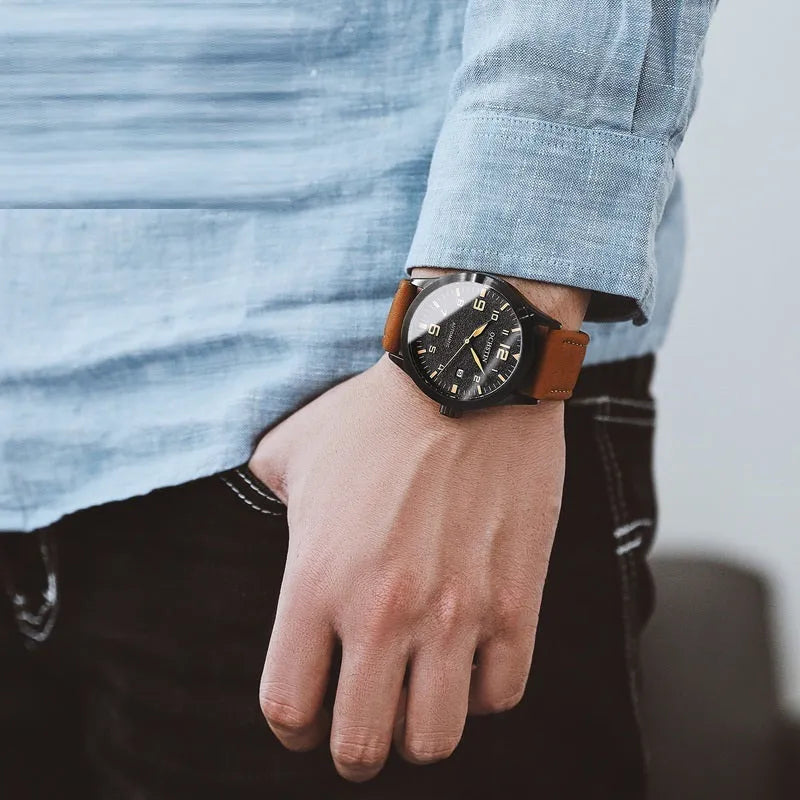 Men's retro automatic watch with leather strap and stainless steel case showing four dial colour variations