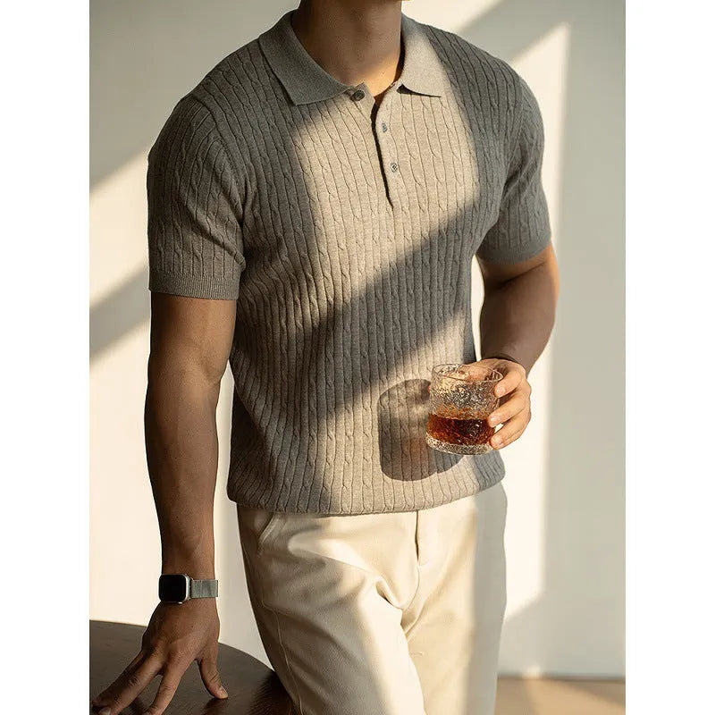 A man's khaki short-sleeve business commute top laid flat, showing its collar and sleeve detail.