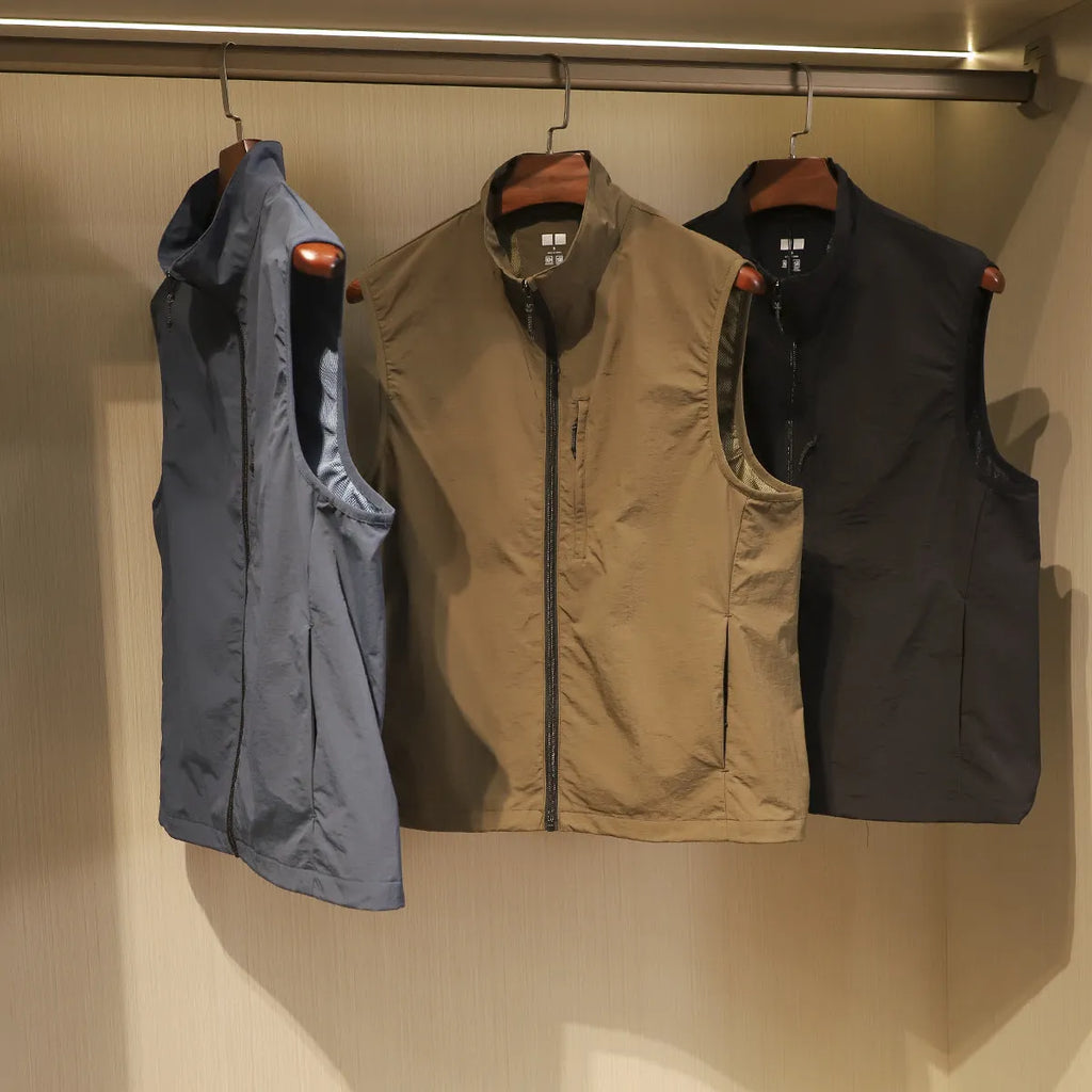 Men's straight-fit nylon cardigan vest in army green with side seam pockets.
