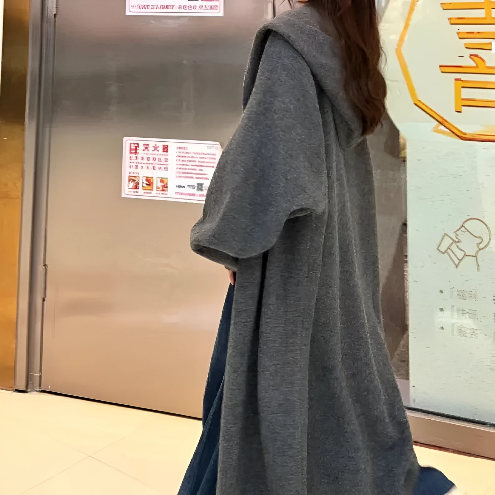 Korean style women's hooded knitted cardigan in wool blend fabric showing below-knee length and loose fit