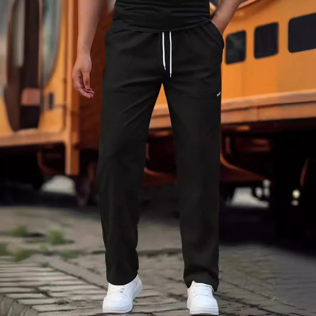 Men's polyester trousers for spring and autumn in various colours including light grey and dark green.
