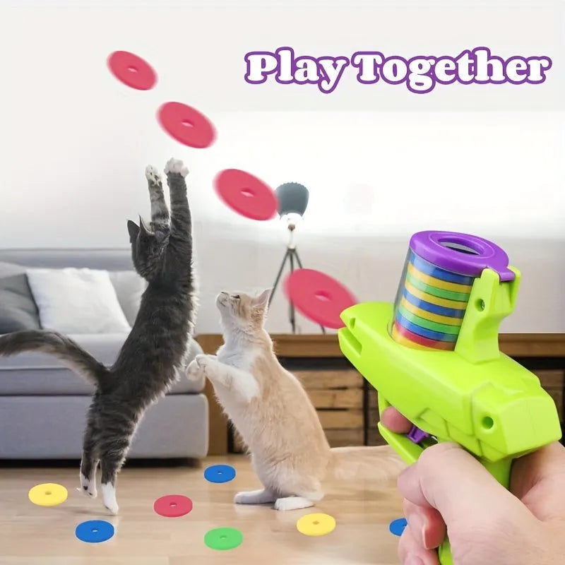 Manual cat toy launcher with foam discs in green and purple colour options for indoor feline play