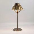 Gold alloy desk lamp with touch control on a wooden desk.