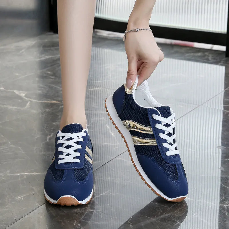 Blue women's casual sports shoes with cross shoulder straps and a round toe.