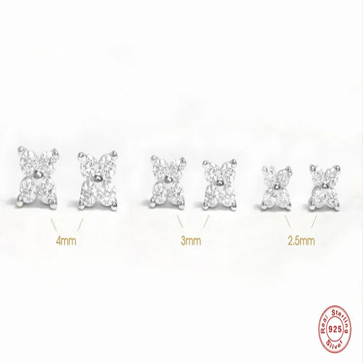 S925 sterling silver stud earrings with a geometric petal and crystal flower design in gold and platinum finishes.