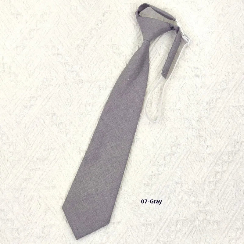 Solid colour cotton bow tie in arrow style showing navy blue option