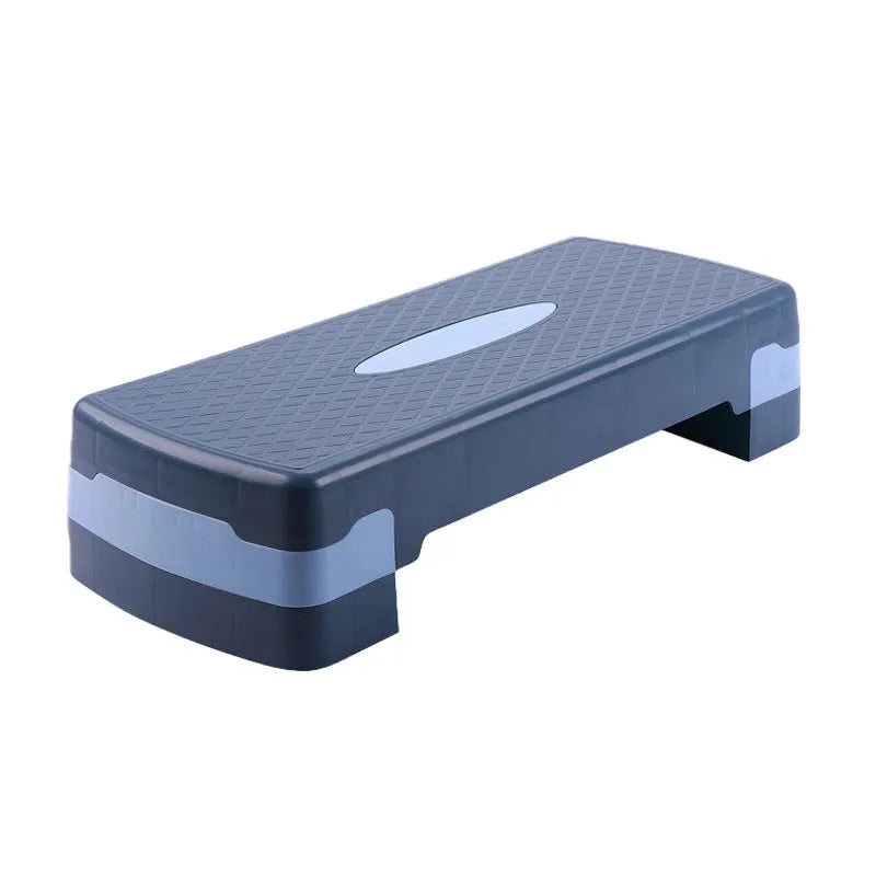 Grey Fit Step aerobics platform on a wooden floor for home fitness workouts.