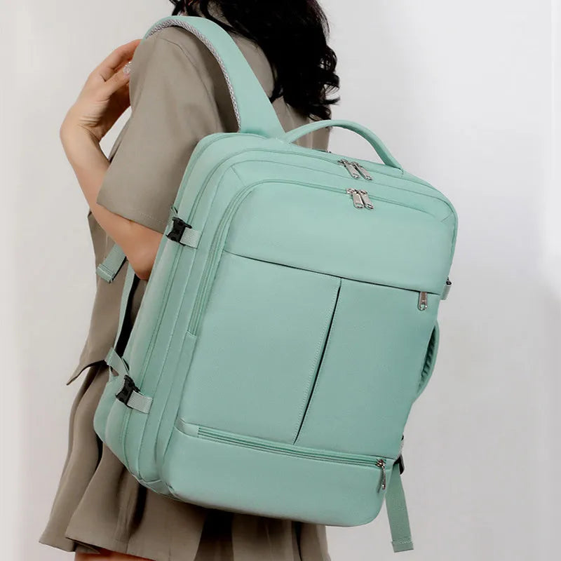 Waterproof Oxford cloth backpack with multiple pockets, shown in black colour, displaying laptop compartment and zippered organisers.