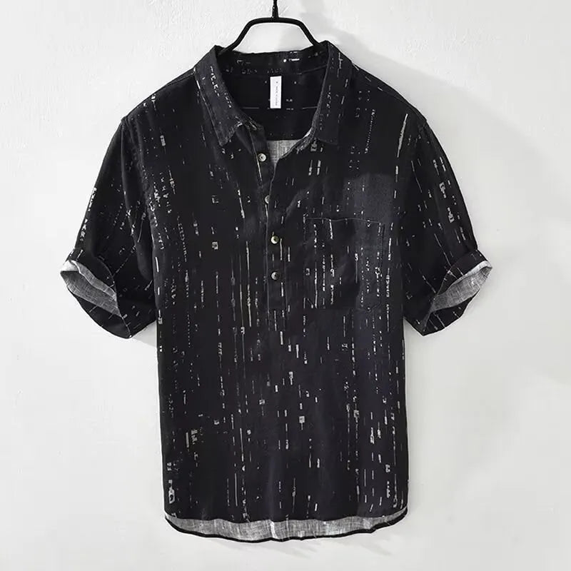 Men's loose fit short sleeve polo shirt in black, shown on a hanger.