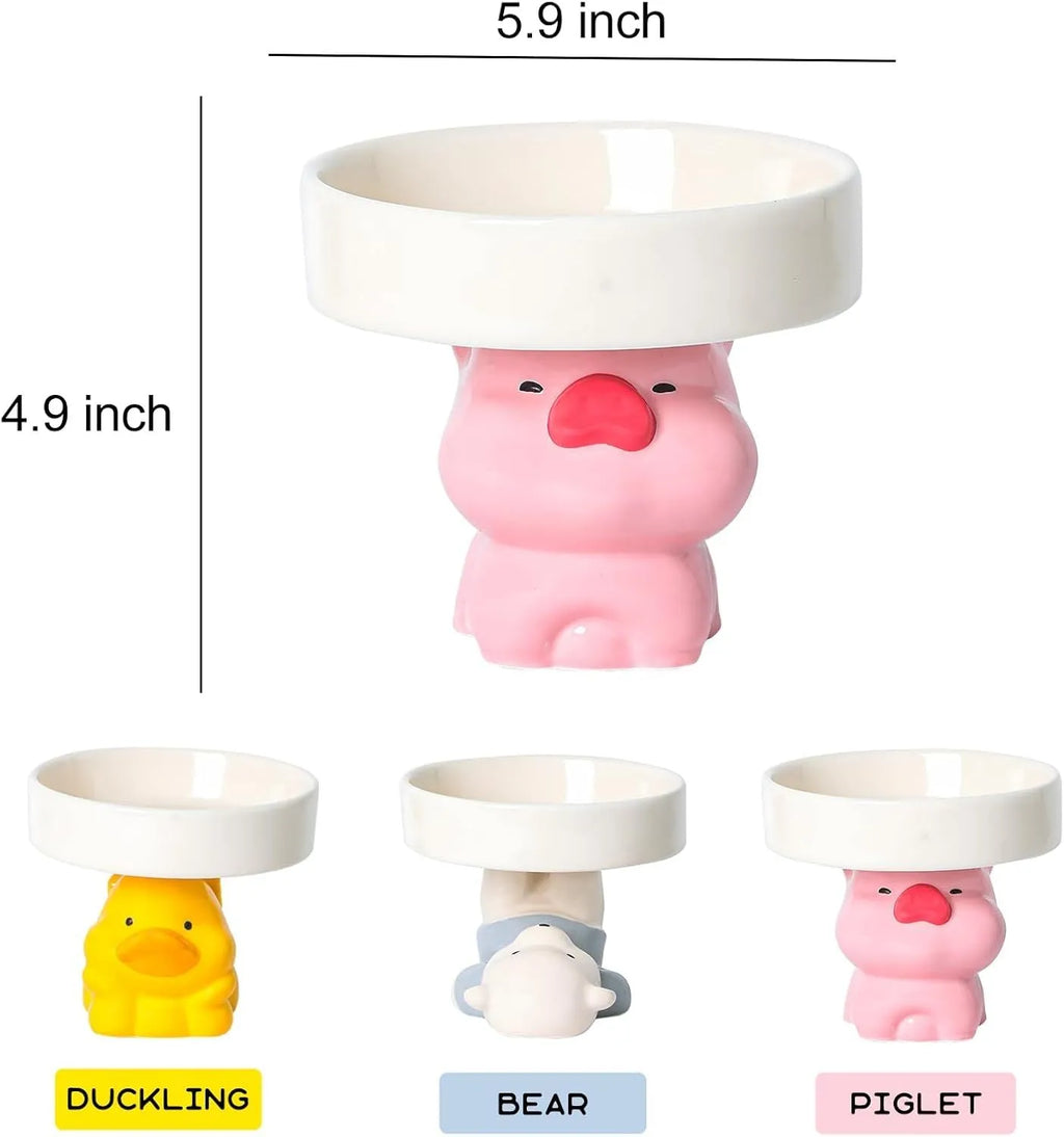 Raised ceramic cat bowl with animal theme design in pink, yellow, or white.