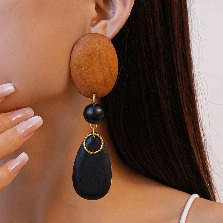 Brown-black wooden elliptical earrings with retro European-American style and silver needle detailing